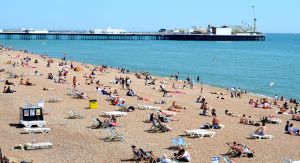 Brighton's pebbled beach and famous pier in the background.
