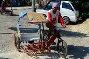 A typical bike/trike. They are often loaded with a couple of people and a pile of goods.